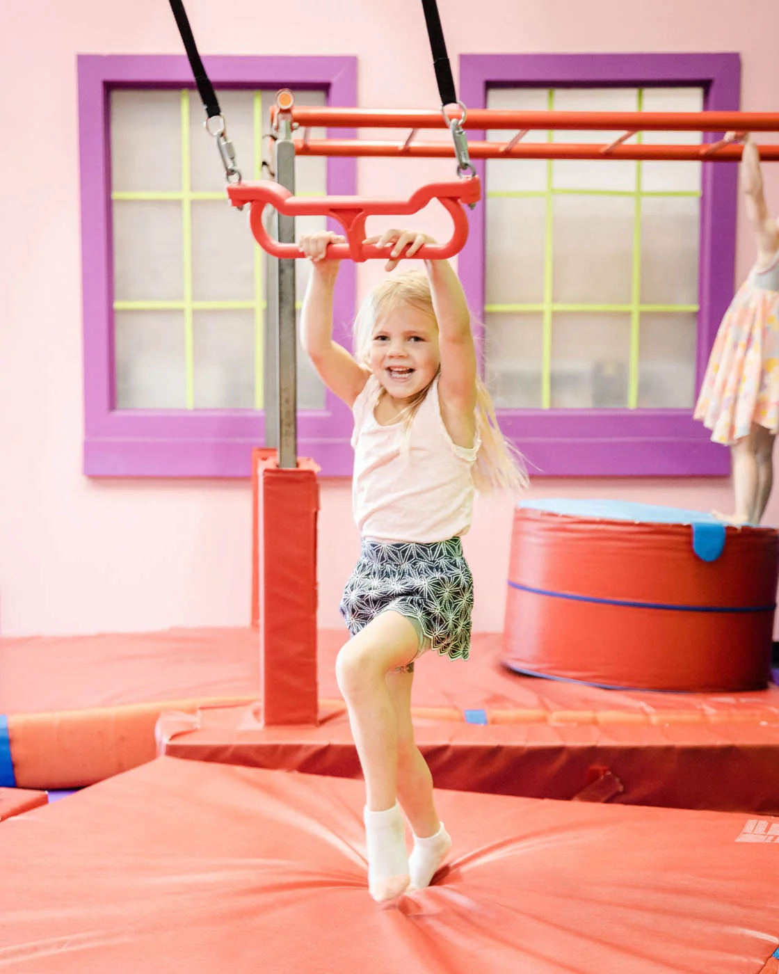 kids-in-gym-74 A little girl enjoying the Romp n' Roll gym, contact us today for more toddler activities.